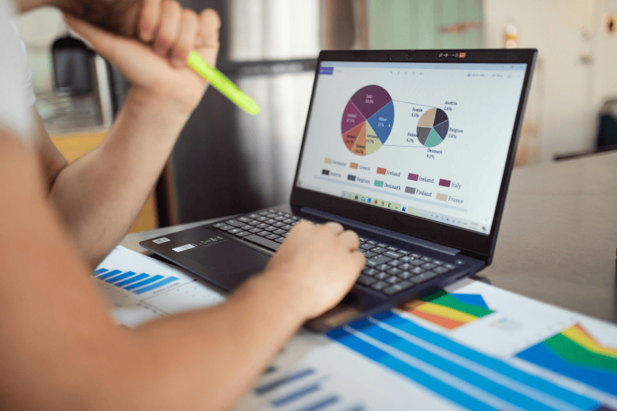 Professional reviewing multiple sales data sets